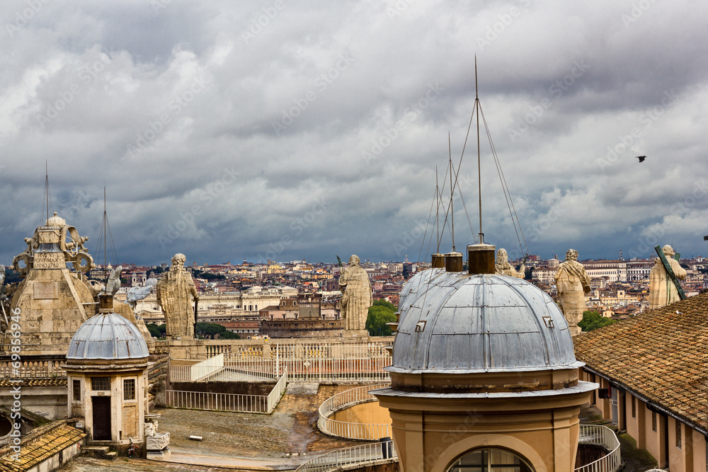 Rome buildings against dark clouds