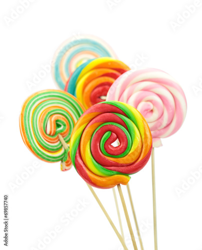 Colorful spiral lollipops on white background