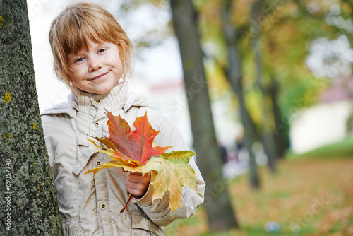 Happy little girl in autumn