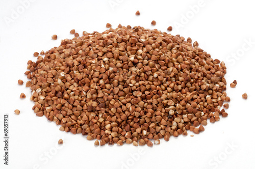 Pile of buckwheat on white background