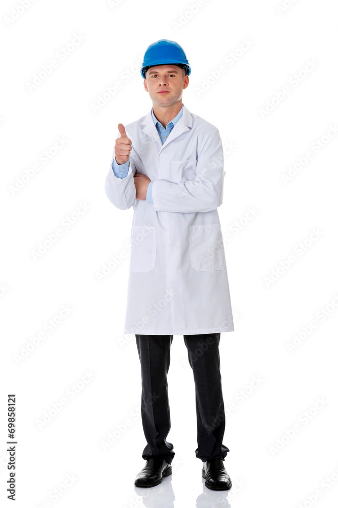 Man in a lab coat and helmet Man in a lab coat and helmet