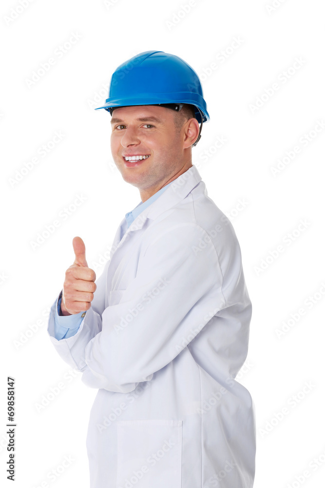 Man in a lab coat and helmet Man in a lab coat and helmet