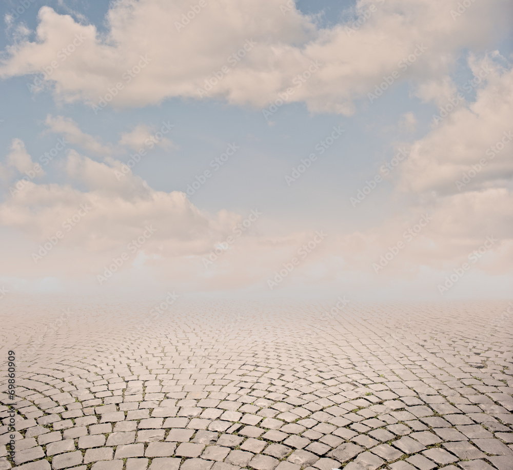 cobblestone background with sky on sunset