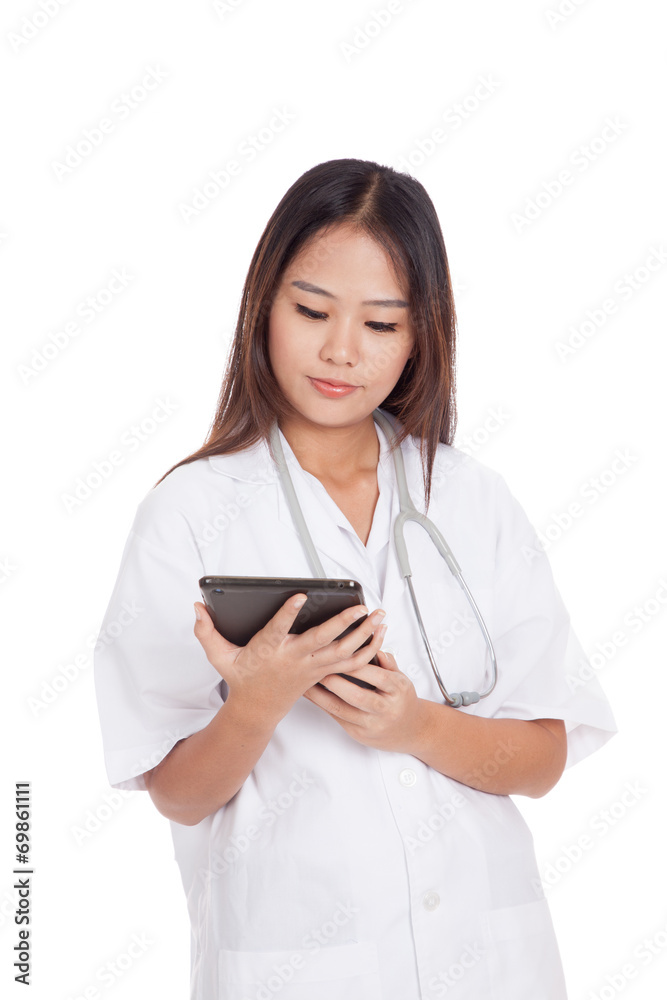 Asian young female doctor use a tablet pc Asian young female doctor use a tablet pc