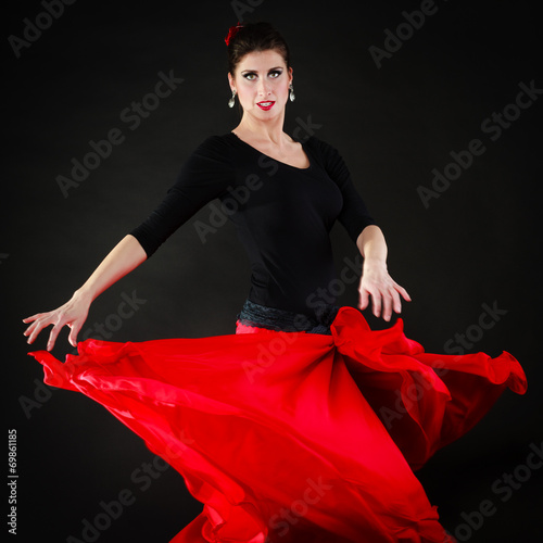 Dance. Spanish girl in red skirt dancing flamenco photo