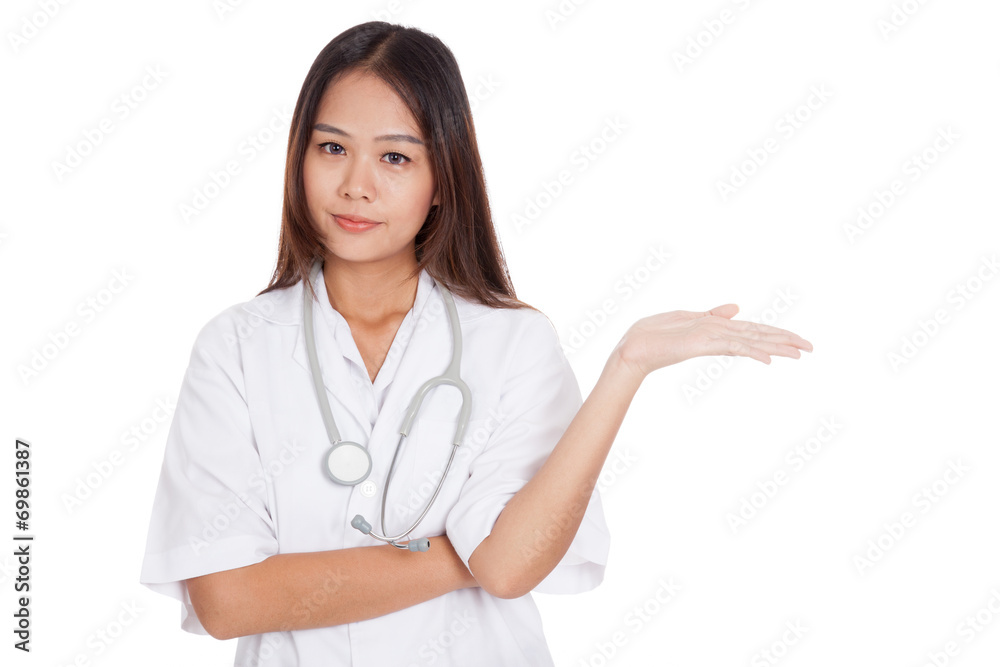 Asian young female doctor show something on her hand Asian young female doctor show something on her hand
