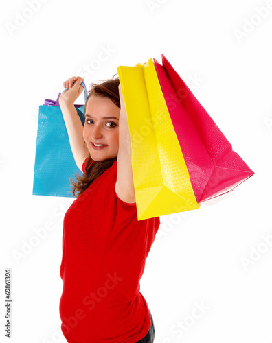 Girl lifting shopping bag's.