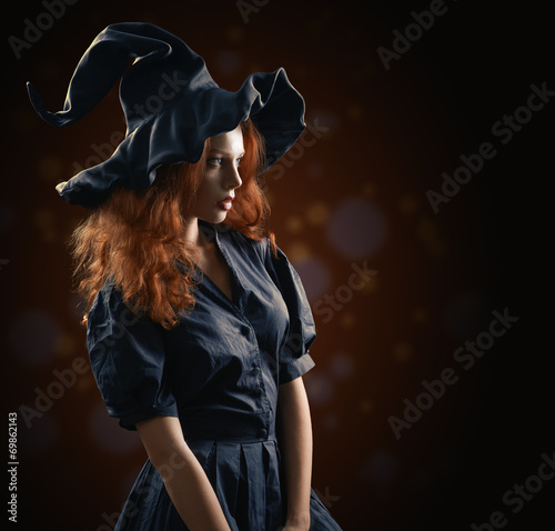 Tablou canvas beautiful red-haired girl in the witch costume