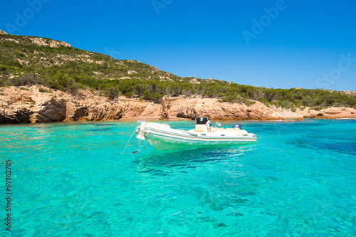 Small boat in turquoise clear sea