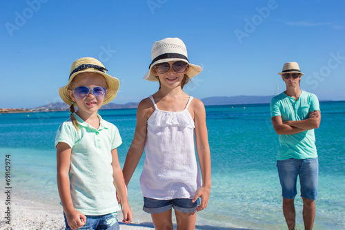 Young beautiful family of three on tropical vacation © travnikovstudio