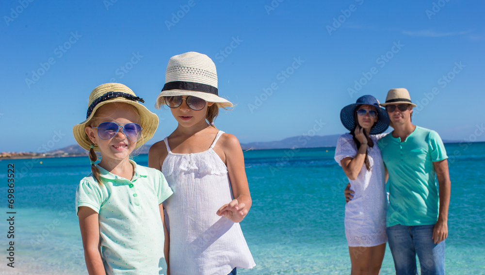 Happy family during summer beach vacation