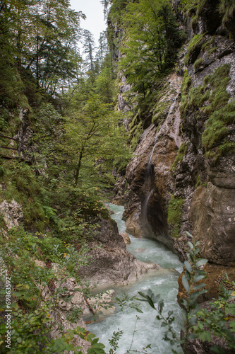 Waterfalls through rocks large cascades down.