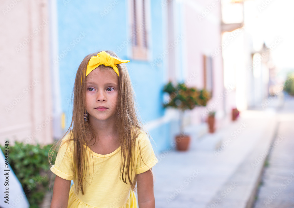 Adorable little girl outdoors during summer vacation Adorable little girl outdoors during summer vacation