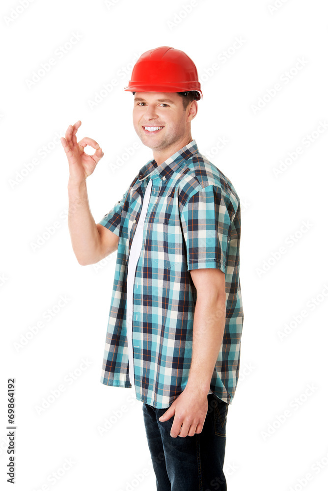 Portrait of a builder in a white helmet