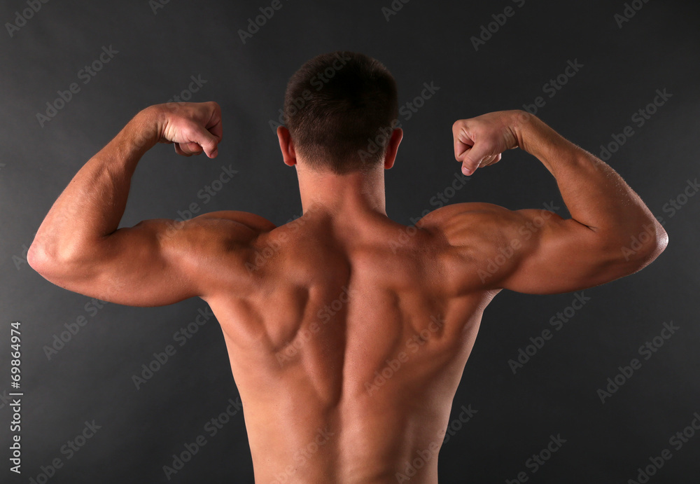 Handsome muscle young man on dark background Handsome muscle young man on dark background