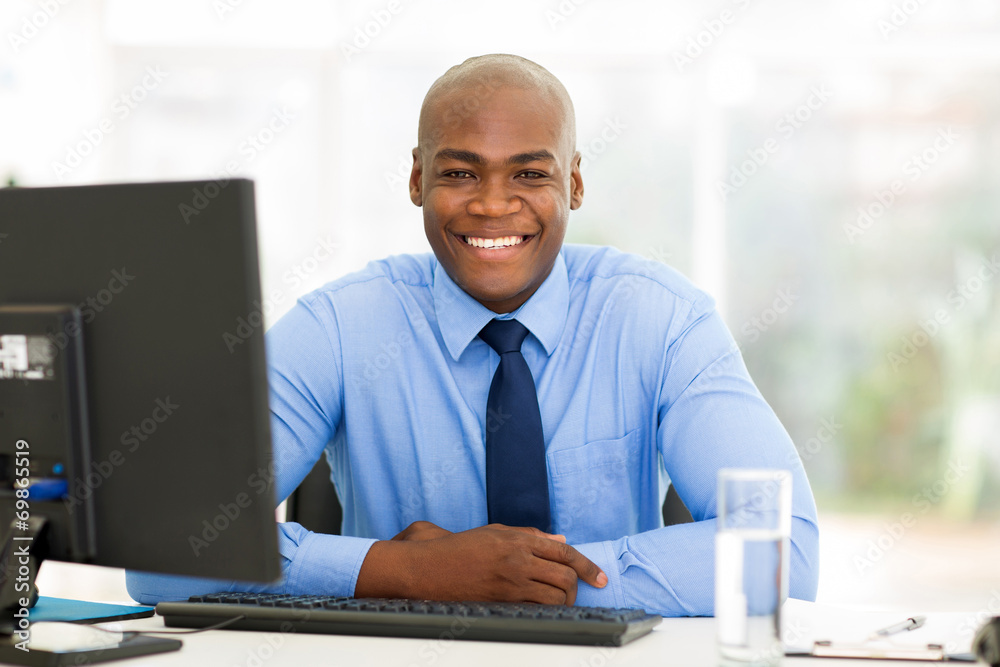 african businessman sitting in office african businessman sitting in office