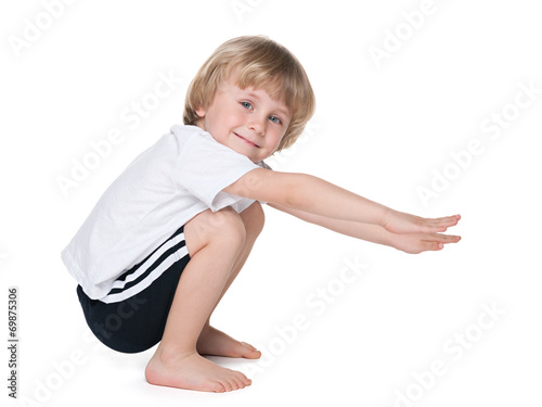 Preschool boy performs exercises