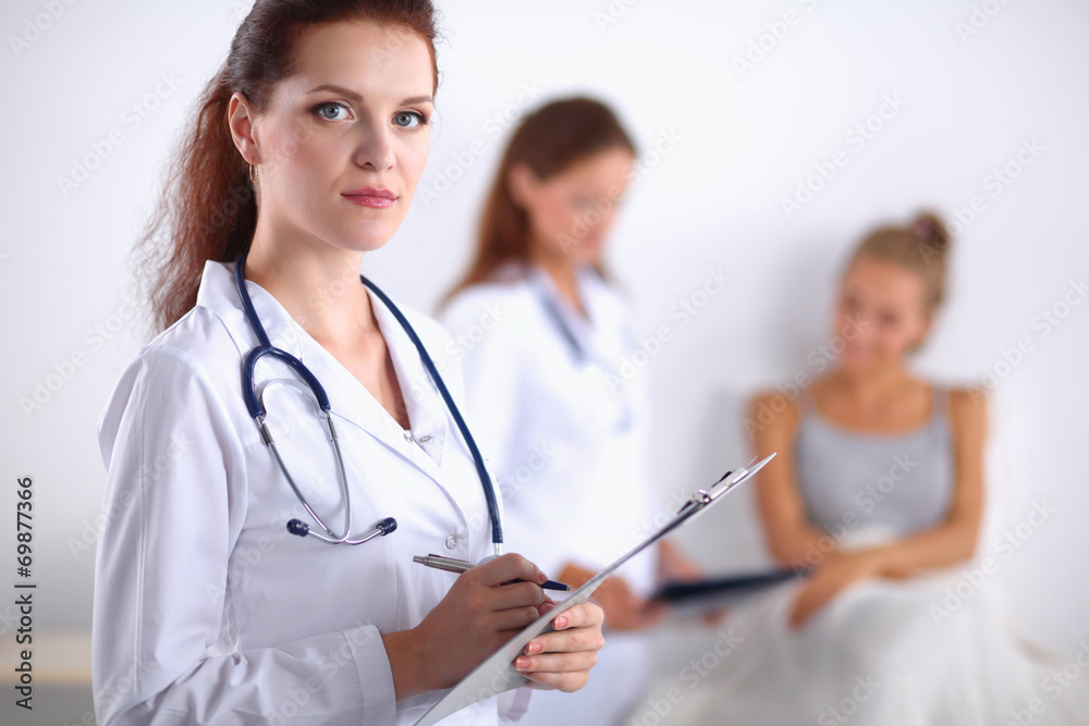 Portrait of woman doctor at hospital with folder Portrait of woman doctor at hospital with folder