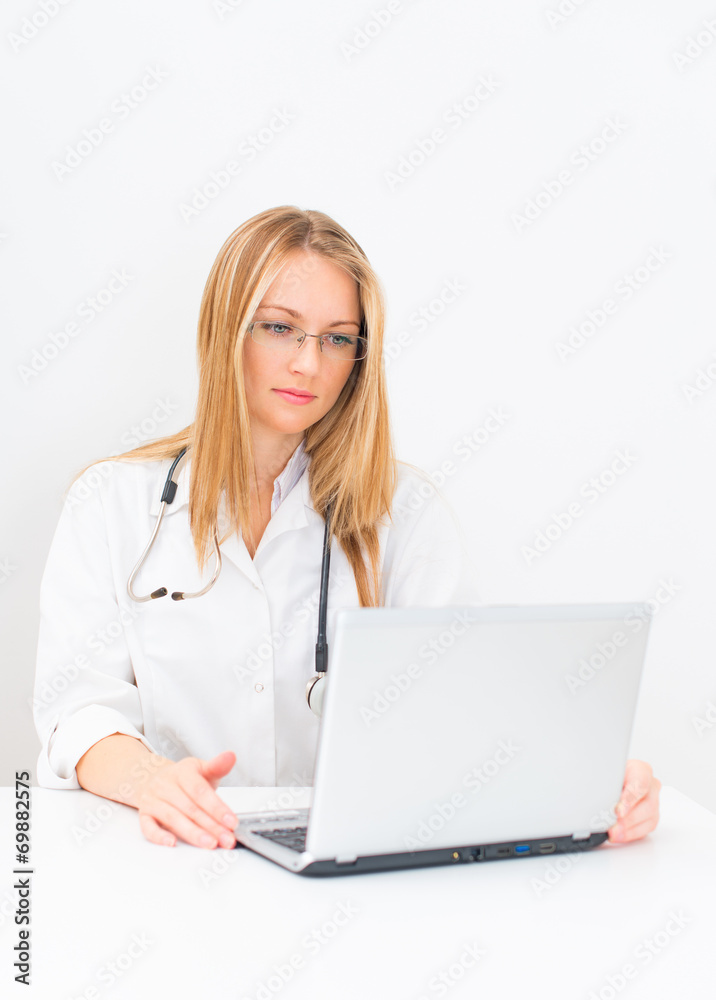 Portrait of female doctor with netbook. Portrait of female doctor with netbook.