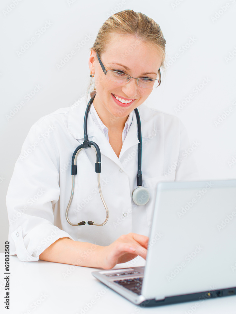 Portrait of smiling female doctor with netbook. Portrait of smiling female doctor with netbook.