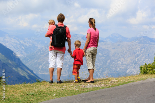 family with kids looking at mountains