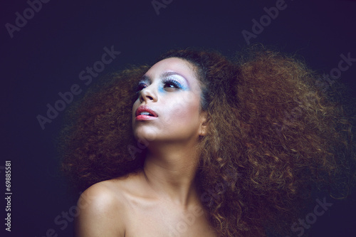 Female fashion model with modern hairstyle