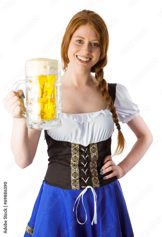 Oktoberfest girl smiling at camera holding beer Oktoberfest girl smiling at camera holding beer