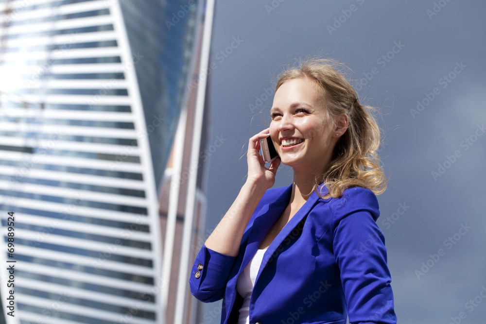 Beautiful young blonde calling by phone Beautiful young blonde calling by phone
