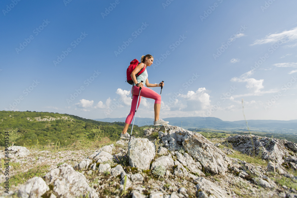 Young woman hiking on the mountain