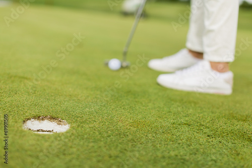 Young woman playing golf