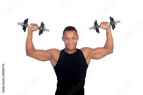 Handsome muscled man training with dumbbells