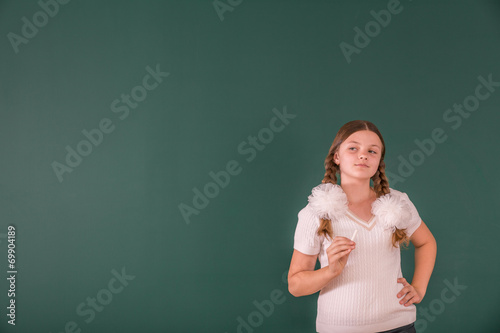 School Girl at a Chalkboard © Mikhail