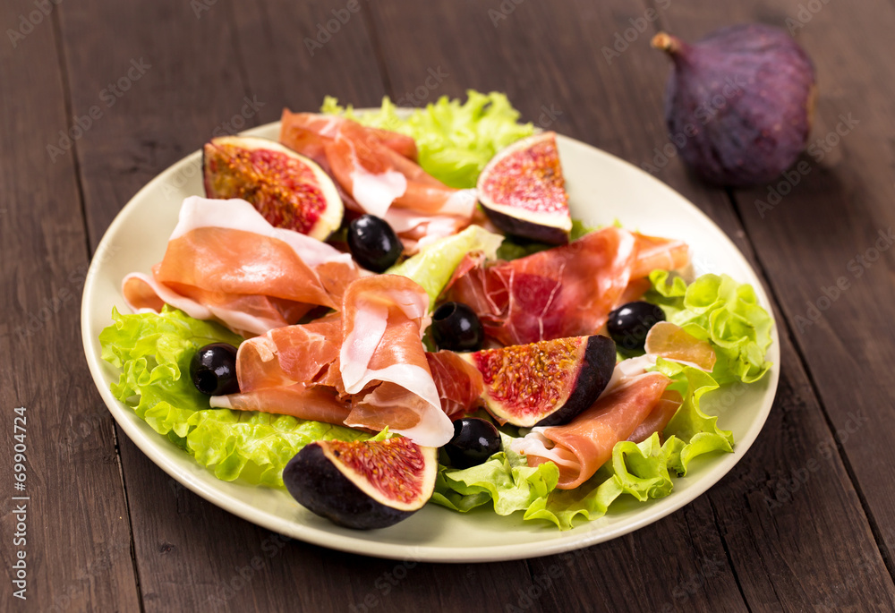 Prosciutto with figs, olives and arugula