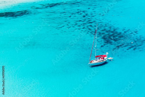 Sailboat anchored in Porto Giunco bay. Sardinia Island. Italy. © el lobo