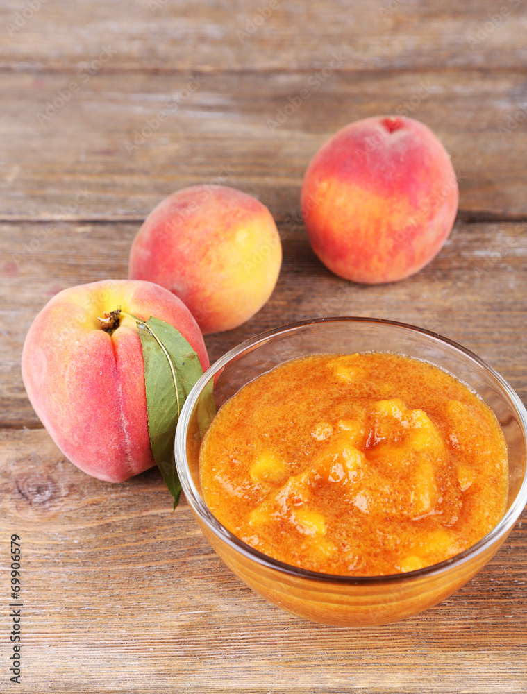 tasty peach jam with fresh peaches on wooden table tasty peach jam with fresh peaches on wooden table