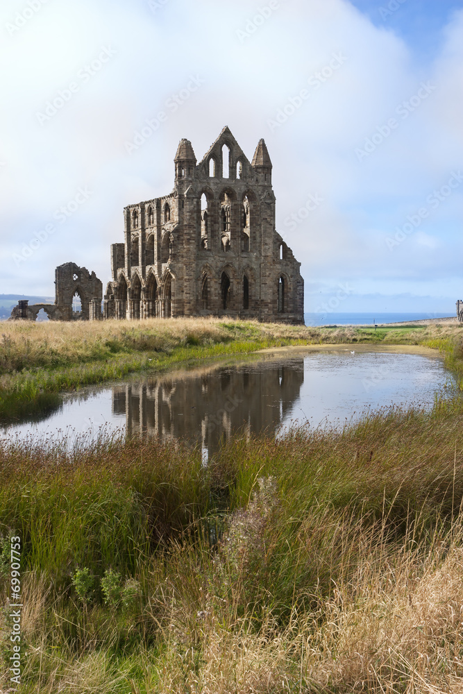 Whitby England next to pond with reflection in the water