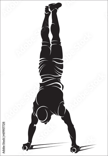 Fotografia Sporty man doing street workout exercise. Handstand