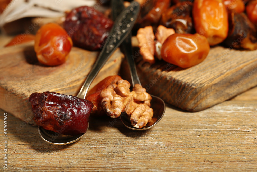 Tasty dates fruits on wooden table Tasty dates fruits on wooden table