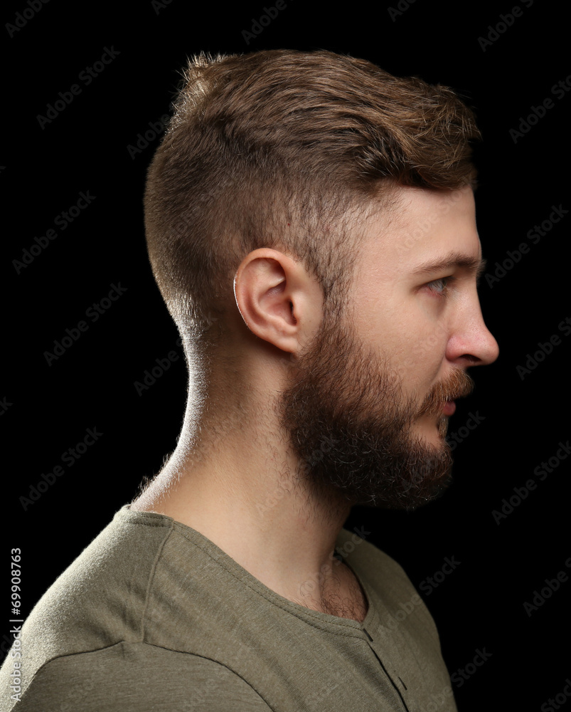 Portrait of handsome man with beard on black background Portrait of handsome man with beard on black background