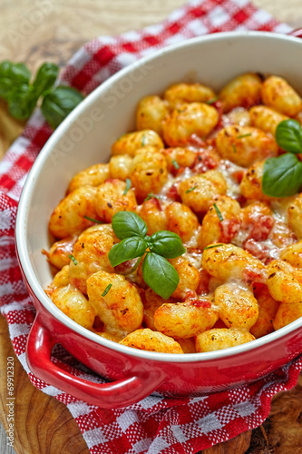 gnocchi with tomato sauce and parmesan cheese photo