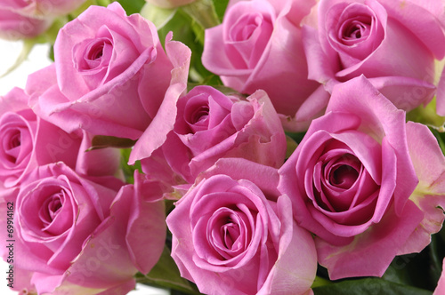 bouquet of pink roses with green leaves
