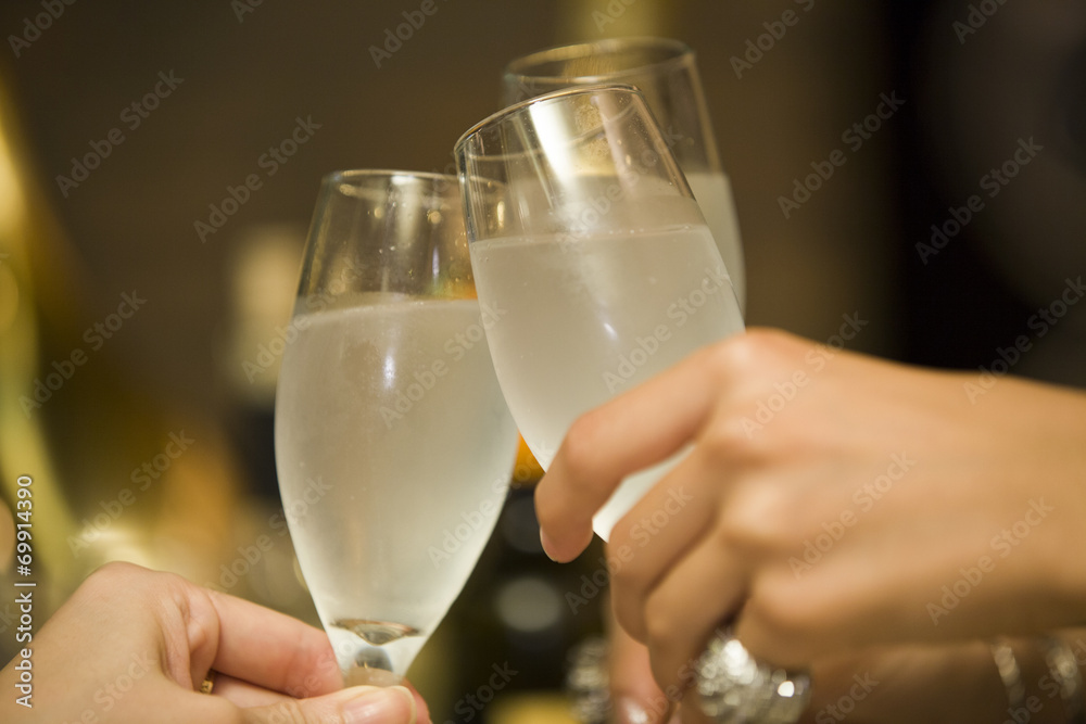 Female hand to toast with champagne