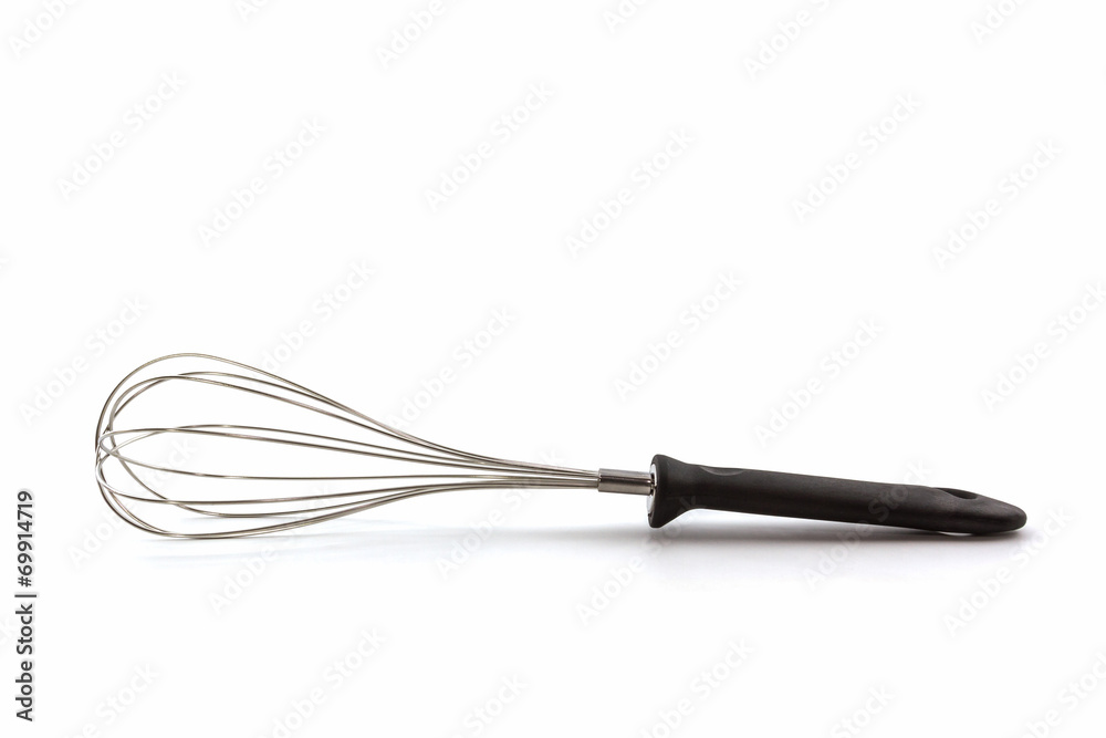 Metal whisk for whipping eggs on white background.