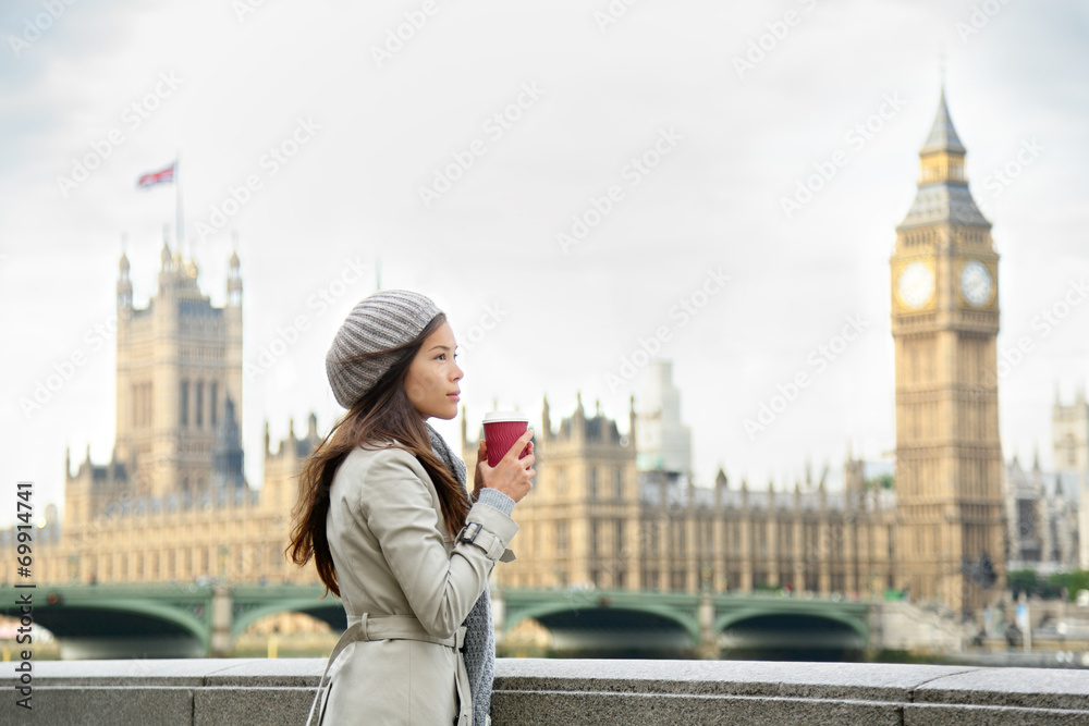 Fototapeta premium London woman drinking coffee by Westminster Bridge