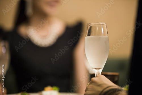 Hands of women with champagne glass