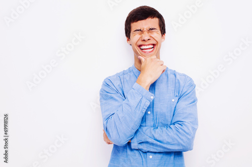 Laughing guy with hand on his chin