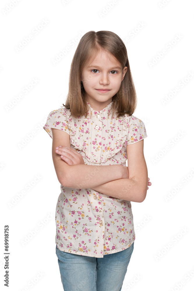 Serious little girl against the white background Serious little girl against the white background