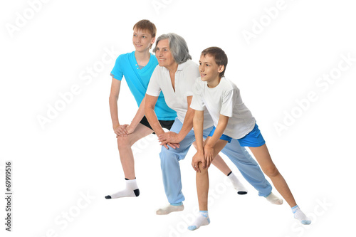 Grandmother exercising with two boys