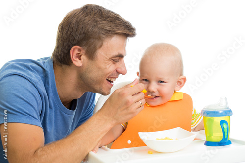 father feeding kid son