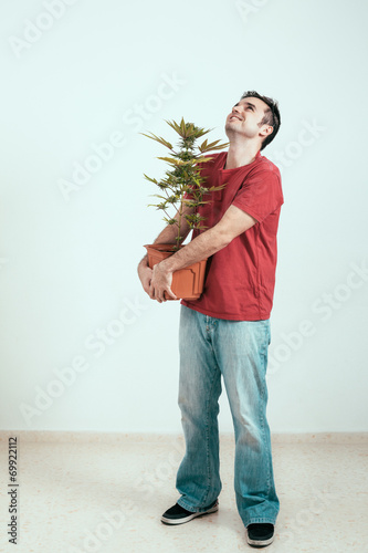 Happy man with Cannabis plant